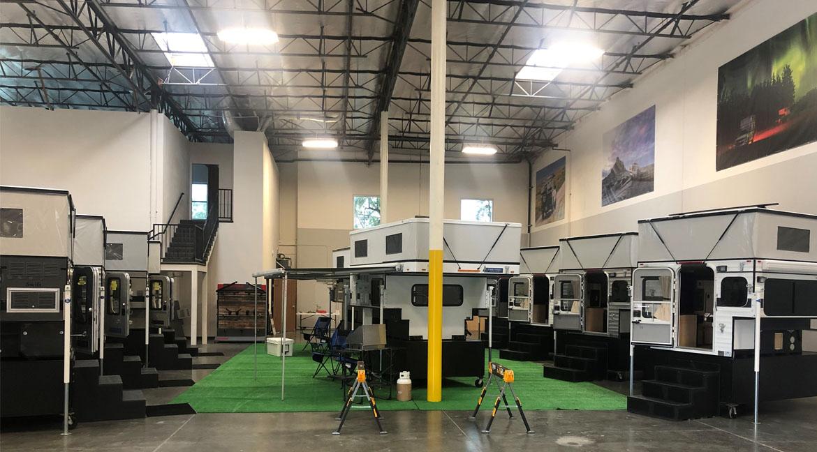 Four Wheel Campers of Southern California's showroom has many available options on display.