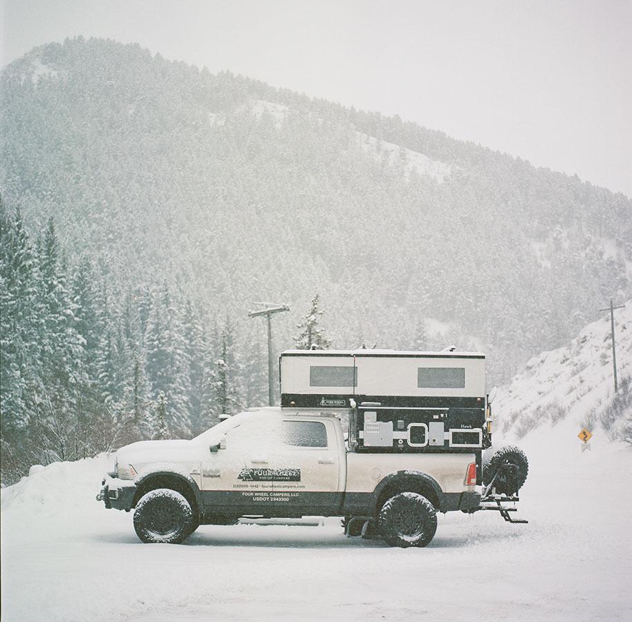 truck camper covered in snow 